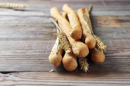 Plakat breadsticks with poppy seeds