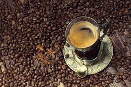 Obraz na płótnie coffee cup on coffee grains background
