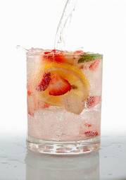 Plakat seltzer drink with fresh cut fruit floating inside