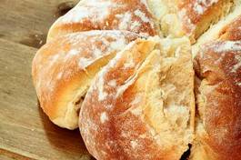 Plakat bread.
fresh homemade loaf of bread on wooden background.