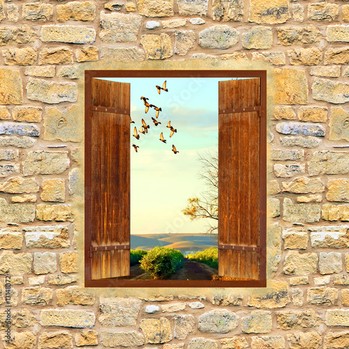 Fototapeta Stare drewniane okno w ceglanym murze