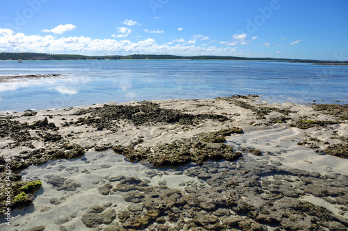 Fotoroleta plaża woda niebo bezdroża