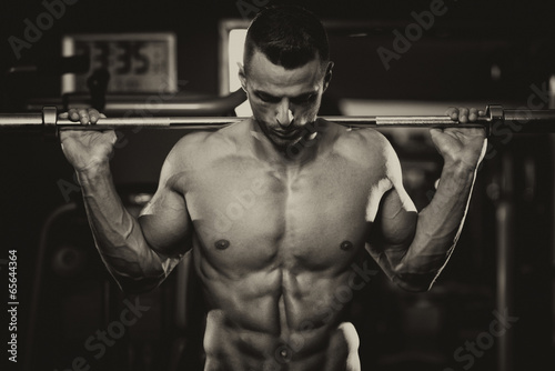 Obraz na płótnie mężczyzna lekkoatletka przystojny witalność siłownia