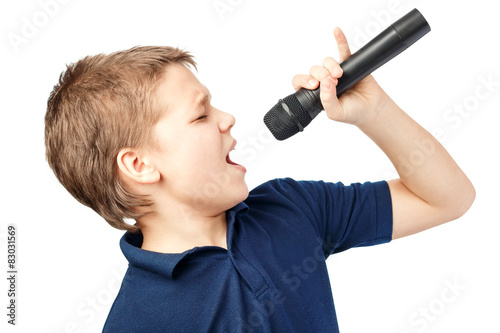 Plakat Boy singing into a microphone. Very emotional.