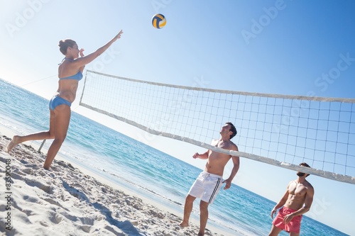 Fototapeta Friends playing volleyball