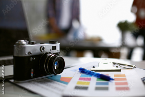 Naklejka Laptop  and camera on the desk