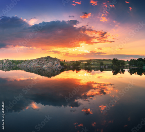 Naklejka Beautiful summer sunset at the river with colorful sky