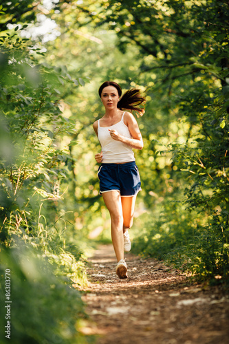 Fotoroleta woman running in the park