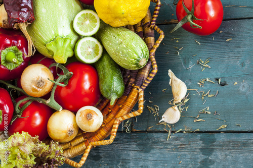 Naklejka Assortment of fresh vegetables on wooden background