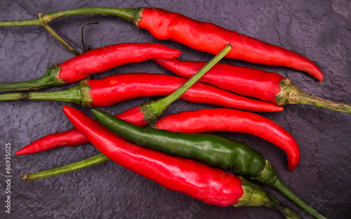 Fotoroleta Red chili with black rock background ,for Backgrounds/Textures