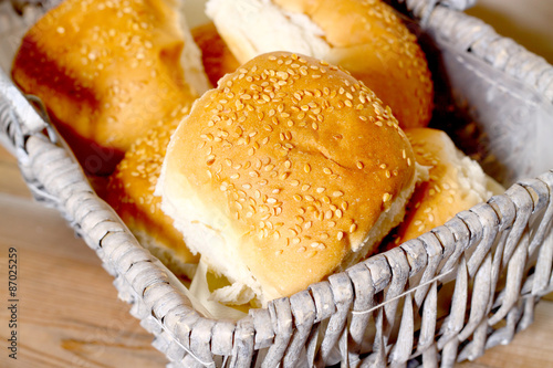 Obraz na płótnie Bread rolls basket.
Sesame seed coated bread rolls in a wicker basket.