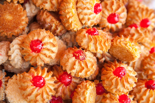 Fototapeta Cookies with red fruit jelly as a background for design